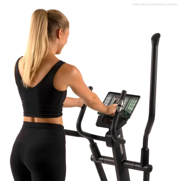 Women standing with CrossPace gym machine