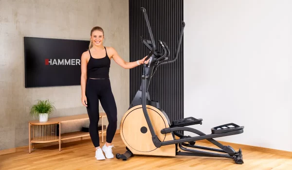 lady standing with hammer cardio machine